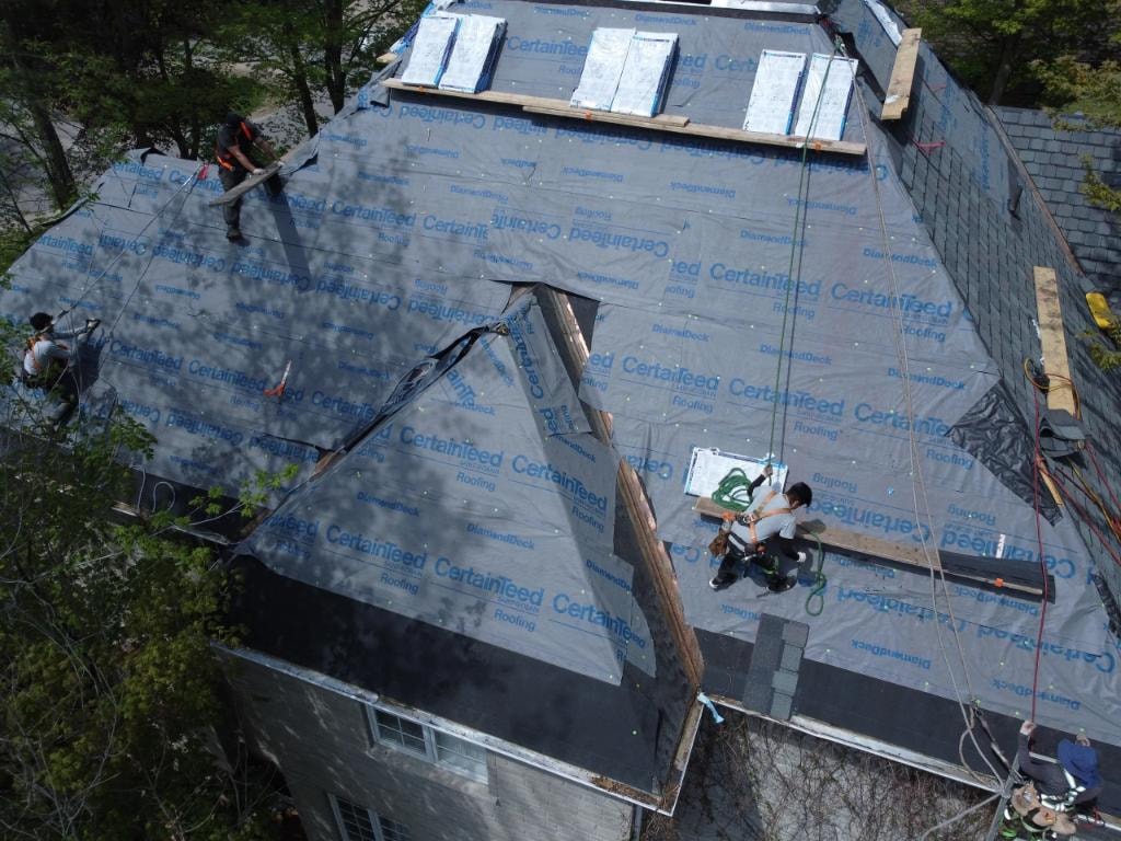 Aerial view of roof under construction with CertainTeed underlayment