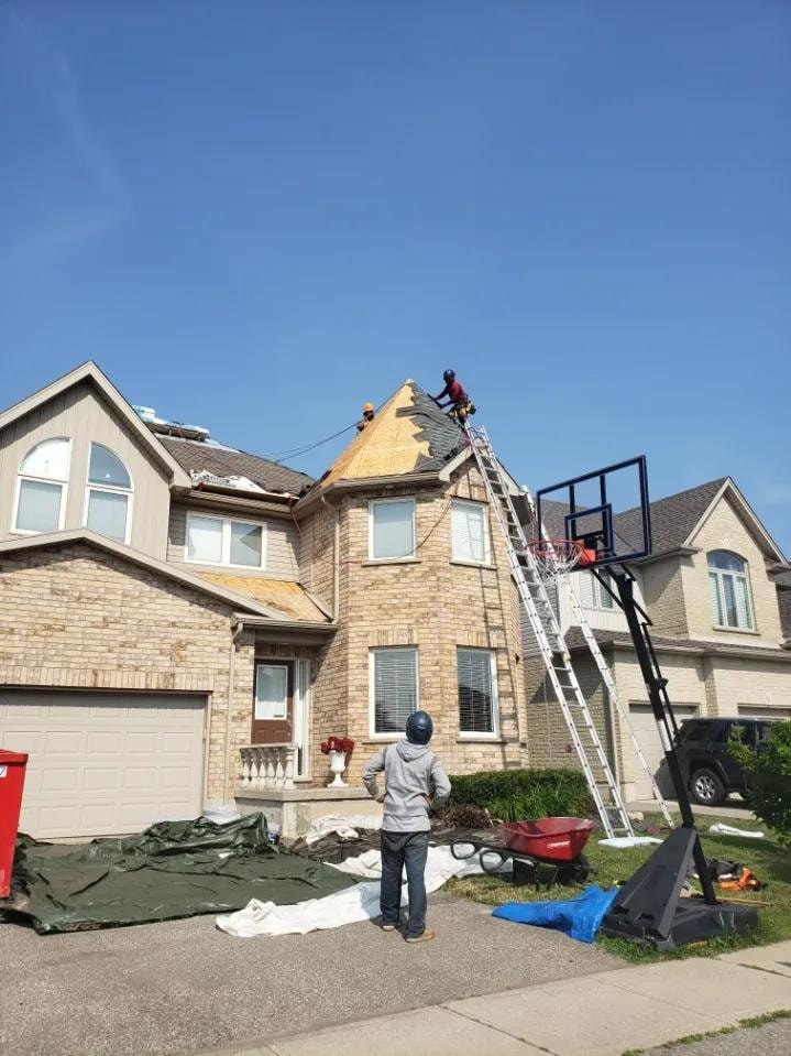 Completed roof with ridge vent and new shingles