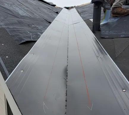 Metal valley flashing installed on roof